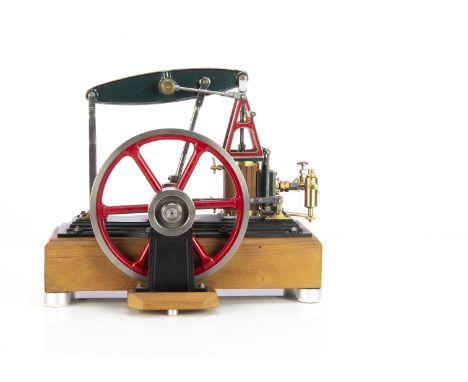 A Stewart Turner Live Steam 'Rotative Half-Beam' Engine, neatly machined and finished in dark green, red and black, with vert