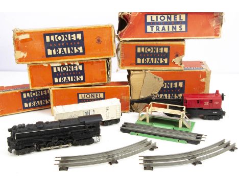Older Lionel 0 Gauge electric Trains, a 6-8-6 turbine locomotive and tender as Pennsylvania No. 671, with 3462 operating milk