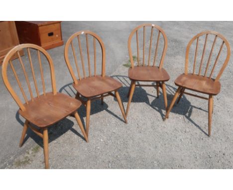 Set of four light elm Ercol stick back dining chairs with H shaped understretcher 