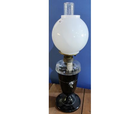 Large late Victorian oil lamp with black glass base, clear glass reservoir and opaque glass shade (height 64cm) 