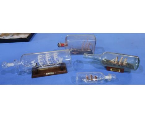 Collection of four ship in bottle figures 