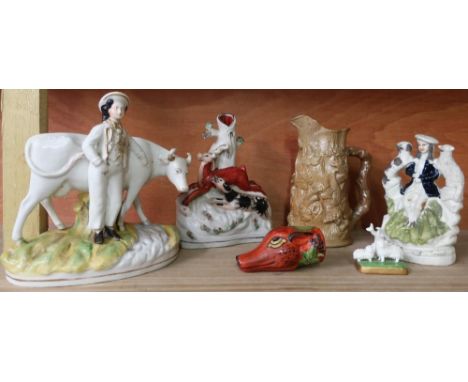 Salt glazed jug, Staffordshire style figures and a fox mask spirit cup 