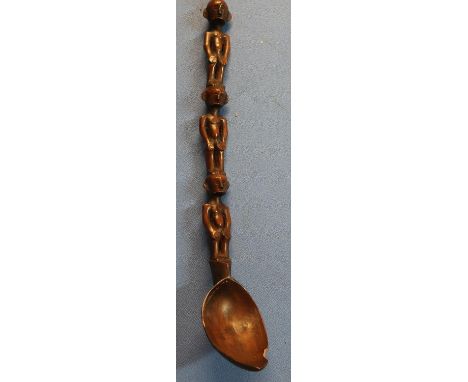 Unusual 19th C native tribal carved wooden spoon, the stem in the form of three male figures (overall length 38cm) 