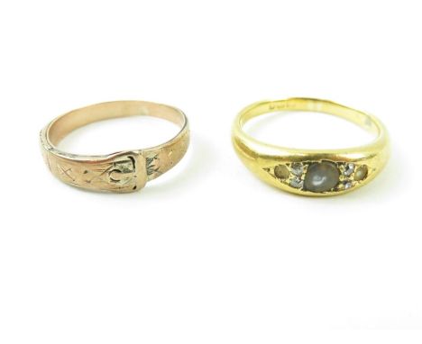 An 18ct gold ring set with old cut diamonds, hallmark rubbed, finger size L 1/2, 4.53g gross; and a buckle ring, finger size 