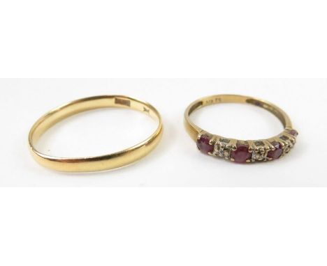 A ruby and diamond half eternity ring, marked '375', finger size L 1/2, 1.06g gross; and a wedding band, marked '22ct', finge