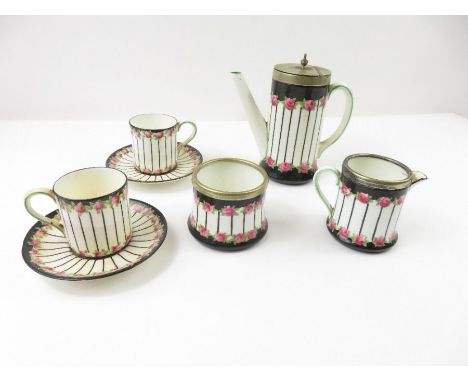 A Crescent dolls bone china part coffee set consisting of a coffee pot, cream jug, sucrier, two cups and two saucers; all dec