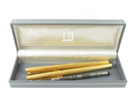 A Dunhill fountain pen and a matching roller ball, in a Dunhill box, together with a Mont Blanc roller ball refill