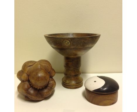 A hand carved wooden offering bowl plus a hand carved Yogin and a wooden hand painted Yin Yang trinket box. (3). 