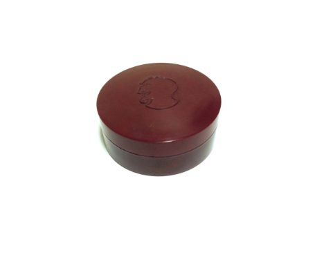 Bakelite trinket pot with a devil's face decoration. 