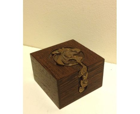 Wooden box with an abstract Steampunk design copper embellishment.