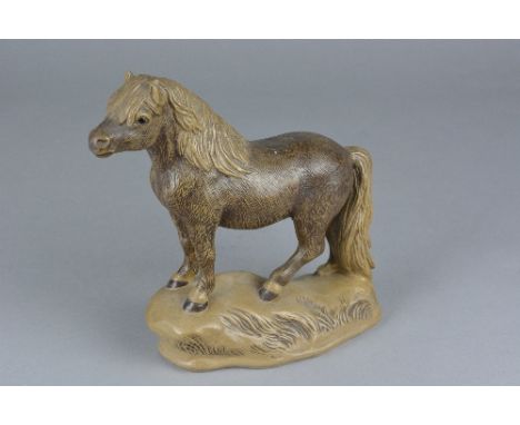 A POOLE POTTERY BARBARA LINLEY ADAMS STONEWARE FIGURE OF A NEW FOREST PONY STANDING ON A MOUND, impressed mark and incised in