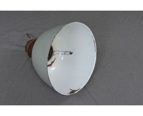 A DOMED PALE GREEN ENAMEL INDUSTRIAL LIGHT