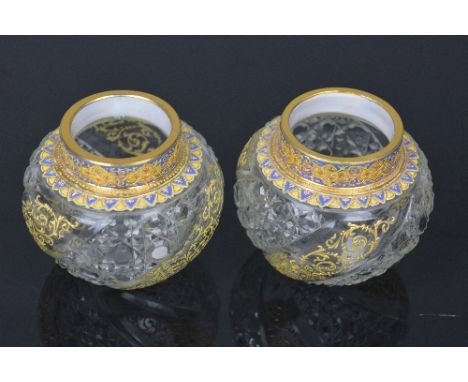 A PAIR OF MOSER BALUSTER VASES, having gilt and enamel decoration to the rim and shoulder over body of cut and clear panels, 