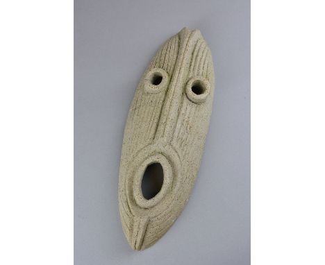 PETER HAYES (B.1946), a ceramic African style mask, having a incised textured body, unsigned, approximately 33cm in length (p