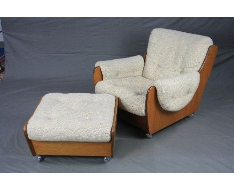 A G-PLAN TEAK SADDLE ARMCHAIR AND STOOL, in the style of Ib Kofod Larsen, covered in oatmeal draylon upholstery on chrome cas