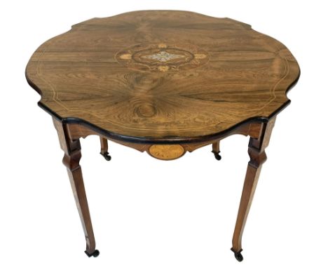 Edwardian rosewood centre table, circular shaped and moulded top with central oval panel decorated with mother of pearl surro