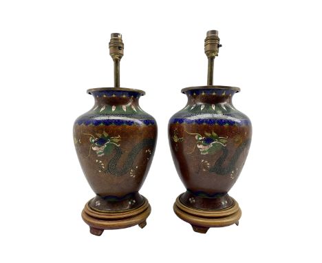 Pair of 20th century Chinese Cloisonne table lamps of baluster form, each decorated with a pair of Dragons chasing the flamin