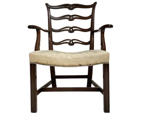 George III mahogany elbow chair, pierced and waived ladder back with foliate carved ears, moulded uprights and serpentine arm