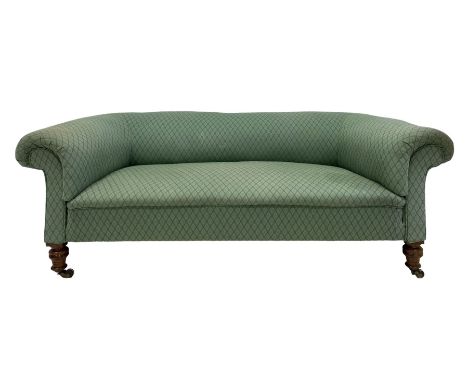 Late Victorian settee, walnut and hardwood framed, upholstered in green lozenge patterned fabric, on ring turned feet with br