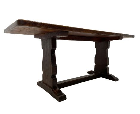 Mouseman - circa. 1940s adzed oak refectory dining table, rectangular pegged plank top, shaped solid end supports on sledge f