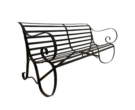 Early-to-mid 20th century strapwork black painted iron garden bench, with scroll arms and supportsDimensions: Height:&nbsp;77