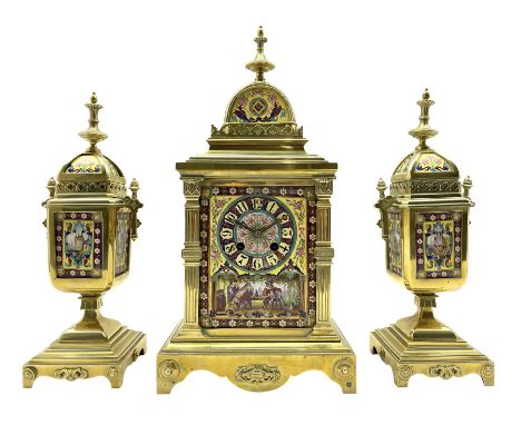 Late 19th century continental brass cased striking mantle clock with a pair of matching brass framed casolets, polished brass