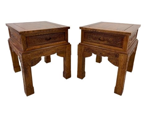 Pair Chinese Imperial style hardwood lamp or side tables, panelled rectangular form, carved with foliate motifs and trailing 