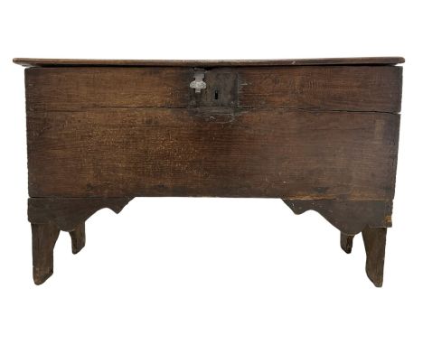 17th/18th century boarded or plank chest, hinged lid enclosing candle box, with incised edge decoration, on bracket end suppo