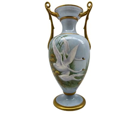 20th century twin handled vase by F. Clark, of ovoid form, hand painted with three swans in flight after Charles Baldwyn, sig