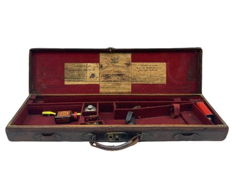 Leather shotgun case with the trade label of Westley Richards &amp; Co., London containing various gun cleaning accessories a