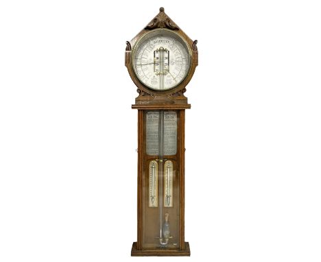 A carved oak �Royal Polytechnic Barometer� manufactured by Joseph Davis & Co, London, c1880, with a foliate carved gable pedi