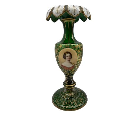 19th century Bohemian green glass table lustre with white overlay acanthus turn-over rim, the body painted with an oval head 
