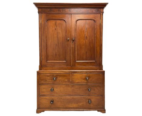 19th century pitch pine housekeeping cupboard, projecting cornice over figured frieze, enclosed by two panelled doors, fitted