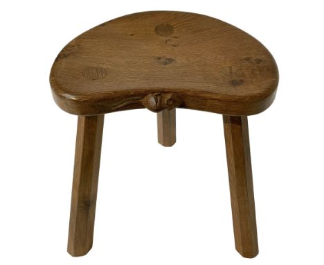 Mouseman - oak three-legged stool, figured dished kidney shaped top carved with mouse signature, on octagonal tapered support