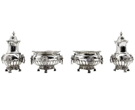 Early 20th century silver double condiment set of circular design with gadrooned borders, lion mask ring handles and masks of