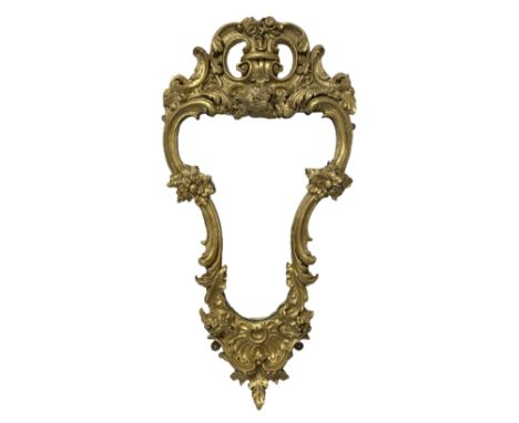 19th century wall mirror in Florentine giltwood and gesso frame, pierced c-scroll cartouche pediment decorated with flower he