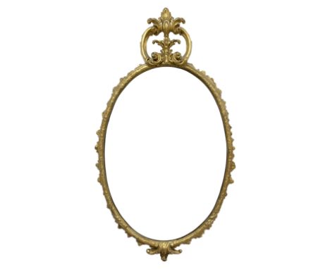 19th century giltwood and gesso wall mirror, the oval frame with c-scroll cartouche pediment decorated with foliage, foliate 