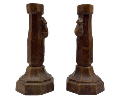 Mouseman - pair circa. 1940s oak candlesticks, tapered octagonal stem on shaped and stepped base, carved with mouse signature