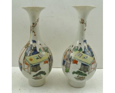 A PAIR OF CHINESE PORCELAIN VASES of pear shape, having flared rims and deep bases with double ring marks in cobalt blue, pai