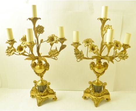 A PAIR OF NEO CLASSICAL DESIGN ORMOLU ELECTROLIERS in the form of ram's head and swag mounted urns, the four light branches a