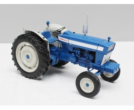 UNIVERSAL HOBBIES A 1:16 SCALE DIE-CAST MODEL OF A FORDSON 5000 6 x 1964 TRACTOR (blue) 