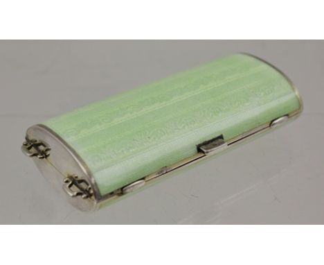 AN ART DECO NECESSAIRE, green guilloche enamel on silver, gilded interior of two compartments and bevel edge mirror 