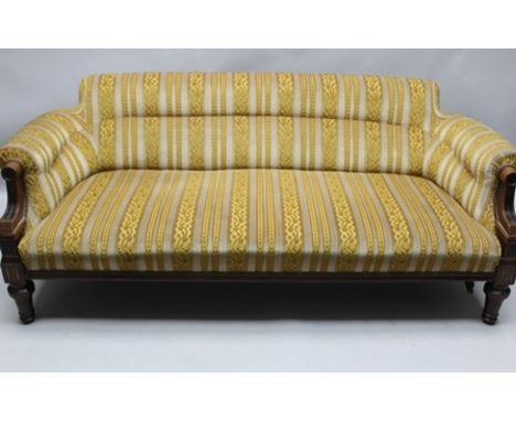 A 19TH CENTURY AESTHETIC PERIOD SHOW WOOD FRAMED LOW BACK SOFA in gold flock striped fabric with decorative stud work,170cm a