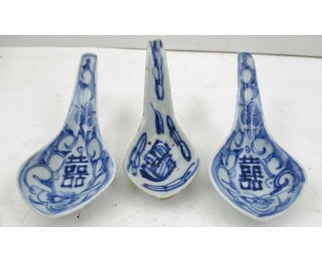 THREE 19TH CENTURY CHINESE GLAZED CERAMIC SPOONS with painted cobalt blue decoration 