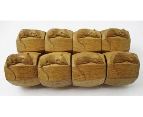 A SET OF EIGHT ROBERT "MOUSEMAN" THOMPSON OAK NAPKIN RINGS of octagonal form, each carved with the signature mouse, 4.7cm hig