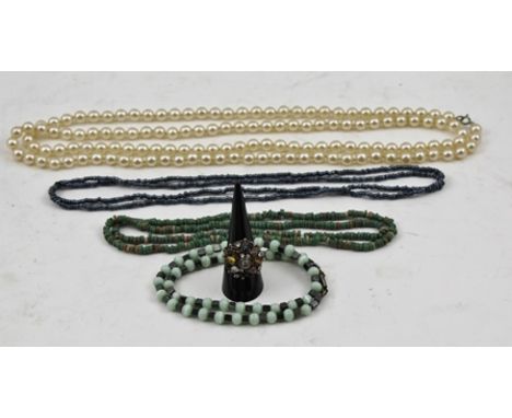 A COLLECTION OF JEWELLERY comprising; an Egyptian bead necklace, a blue/grey bead necklace, a green onyx bead necklace, a sim