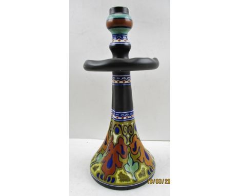 A GOUDA CANDLESTICK, decoratively glazed pottery with drip tray, flared lobed base, bears painted factory marks within, 31cm 