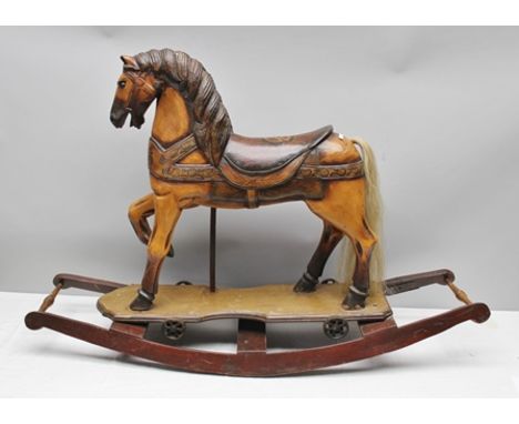 A VICTORIAN DESIGN ROCKING HORSE on bow rockers, with painted decoration, 81cm high 