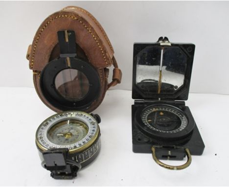 TWO SECOND WORLD WAR COMPASSES, one dated 1943, ref. no.12858C, with floating mother-of-pearl disc, in leather carry case, th