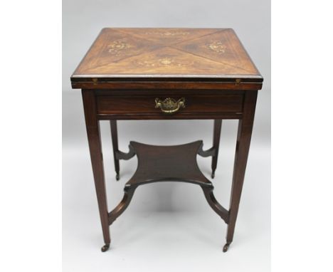 A LATE 19TH/ EARLY 20TH CENTURY INLAID ENVELOPE TOPPED CARD TABLE, finished in rosewood, fitted a single drawer, supported on